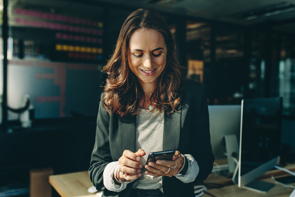 female candidate using a phone in office.